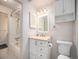 Clean and well-maintained bathroom with white vanity, and shower/tub combo at 309 E Highline Cir # 104, Centennial, CO 80122