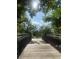Scenic bridge surrounded by lush trees and greenery, adding charm to the community at 309 E Highline Cir # 104, Centennial, CO 80122