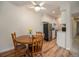 Cozy dining area with wooden table and chairs, adjacent to the kitchen with stainless steel appliances at 309 E Highline Cir # 104, Centennial, CO 80122