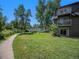 Serene community grounds featuring well-manicured lawns and walking paths near apartments with balconies at 309 E Highline Cir # 104, Centennial, CO 80122