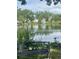 Calm pond provides a serene backdrop with a bench to enjoy a relaxing view at 309 E Highline Cir # 104, Centennial, CO 80122