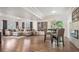 Finished basement with ample seating, decorative fireplace, wood flooring and natural lighting at 7007 S Garrison St, Littleton, CO 80128