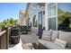 Inviting deck with comfortable seating, outdoor lighting, gas grill, and great backyard views at 7007 S Garrison St, Littleton, CO 80128
