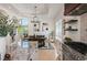 Open-concept kitchen and dining area, great for entertaining guests at 7007 S Garrison St, Littleton, CO 80128