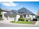 Lovely two-story home with a three car garage and manicured front yard at 7007 S Garrison St, Littleton, CO 80128