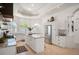 Bright, spacious kitchen with granite countertops, large island, and stainless appliances at 7007 S Garrison St, Littleton, CO 80128
