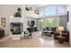Comfortable living room with modern fireplace, plush seating, and ample natural light at 7007 S Garrison St, Littleton, CO 80128