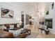 Spacious living room with fireplace, open floor plan, and wine storage at 7007 S Garrison St, Littleton, CO 80128