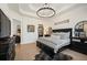 Elegantly decorated main bedroom with tray ceiling, and sophisticated furniture at 7007 S Garrison St, Littleton, CO 80128