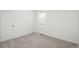 This bedroom features neutral carpet, a window with blinds, and a closet for an inviting space at 3365 N Coolidge Way, Aurora, CO 80019