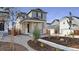 Charming two-story home featuring a stone facade, covered porch, and xeriscaped front yard at 3365 N Coolidge Way, Aurora, CO 80019