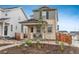 Attractive two-story home with a covered entry and beautifully landscaped front yard at 3365 N Coolidge Way, Aurora, CO 80019