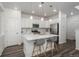 Bright and modern kitchen featuring a large center island with seating and stainless steel appliances at 3365 N Coolidge Way, Aurora, CO 80019