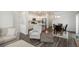 Open-concept living space featuring a cozy living room, dining area, and modern kitchen at 3365 N Coolidge Way, Aurora, CO 80019