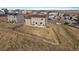 Aerial view of the backyard and neighboring homes in the community at 42855 Hawktree Cir, Elizabeth, CO 80107