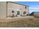 View of patio area with outdoor seating, grill, and stylish furniture, perfect for outdoor entertainment at 42855 Hawktree Cir, Elizabeth, CO 80107
