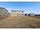 View of backyard with patio, wood fence, seating, and grill, perfect for outdoor gatherings at 42855 Hawktree Cir, Elizabeth, CO 80107