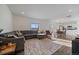 Spacious living room with abundant natural light and seamless flow to dining area and kitchen at 42855 Hawktree Cir, Elizabeth, CO 80107