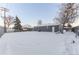 Snowy backyard with large yard space at 121 Joan Dr, Denver, CO 80221