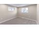 Bright bedroom with neutral walls and grey carpet at 121 Joan Dr, Denver, CO 80221