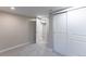 Cozy bedroom featuring neutral paint, carpeted floor, and closet with sliding doors at 121 Joan Dr, Denver, CO 80221