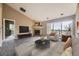 Comfortable living room with fireplace, large windows, and balcony access at 7415 S Alkire St # 302, Littleton, CO 80127