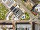 Urban landscape captured from above, showcasing the buildings proximity to a pool and green community spaces at 100 Park Ave # 907, Denver, CO 80205