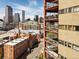 Elevated cityscape view from the building, highlighting surrounding brick buildings and downtown in the background at 100 Park Ave # 907, Denver, CO 80205
