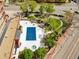 Aerial perspective showcasing the outdoor swimming pool, green space, and community amenities, nestled in the city at 100 Park Ave # 907, Denver, CO 80205