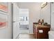 Bathroom view to the bedroom, showcasing granite counters and modern fixtures at 100 Park Ave # 907, Denver, CO 80205