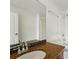 Bathroom featuring granite countertop, wood vanity, large mirror, and a shower/tub combo at 100 Park Ave # 907, Denver, CO 80205