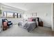 Serene bedroom with a cityscape view, modern décor, and comfortable furnishings at 100 Park Ave # 907, Denver, CO 80205