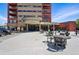 Inviting building entrance featuring seating, a covered entrance, and sleek design at 100 Park Ave # 907, Denver, CO 80205