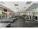 Modern fitness center with treadmills, weights, and equipment for residents at 100 Park Ave # 907, Denver, CO 80205