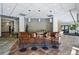 Lounge area featuring a bar, stylish seating, and modern design at 100 Park Ave # 907, Denver, CO 80205