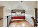 Cozy attic space with patterned floors, red-accented wall and a window at 1229 Josephine St, Denver, CO 80206