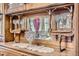 Close-up of an antique china cabinet displaying decorative dishware and mirrored accents at 1229 Josephine St, Denver, CO 80206