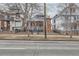View of the classic brick home, showcasing its architectural details and neighborhood setting at 1229 Josephine St, Denver, CO 80206