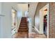 Hallway with stairs, hardwood floors, and original architectural details at 1229 Josephine St, Denver, CO 80206