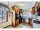 Functional kitchen featuring ample cabinet space, modern appliances, and a window overlooking the yard at 1229 Josephine St, Denver, CO 80206