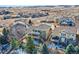 Aerial view of the beautiful two-story home showcasing its balcony and well-manicured backyard at 10726 Amesbury Way, Highlands Ranch, CO 80126