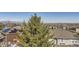 Aerial view of the neighborhood with surrounding cityscape and snow-capped mountains in the distance at 10726 Amesbury Way, Highlands Ranch, CO 80126