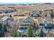 Two-story home with deck and patio nestled in a residential neighborhood with mountain views at 10726 Amesbury Way, Highlands Ranch, CO 80126
