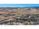 Wide aerial shot displaying the peaceful community and the beautiful landscape in the background at 10726 Amesbury Way, Highlands Ranch, CO 80126