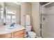 Traditional bathroom features a vanity with a sink and a shower at 10726 Amesbury Way, Highlands Ranch, CO 80126