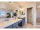 Bright primary bathroom with double vanity, a soaking tub, and a separate glass shower at 10726 Amesbury Way, Highlands Ranch, CO 80126