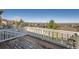 Enjoy scenic mountain views from this deck with white railings at 10726 Amesbury Way, Highlands Ranch, CO 80126