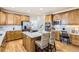 Well-appointed kitchen features an island with bar seating and stainless steel appliances at 10726 Amesbury Way, Highlands Ranch, CO 80126