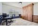 Home office featuring a built-in Murphy bed with storage and a comfortable workspace at 10726 Amesbury Way, Highlands Ranch, CO 80126