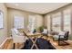 Comfortable office space with ample natural light, hardwood floors, and stylish decor at 10726 Amesbury Way, Highlands Ranch, CO 80126